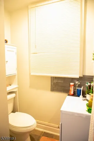 a bathroom with a sink a toilet and tub