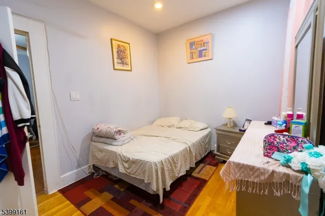 a bedroom with bed and a window