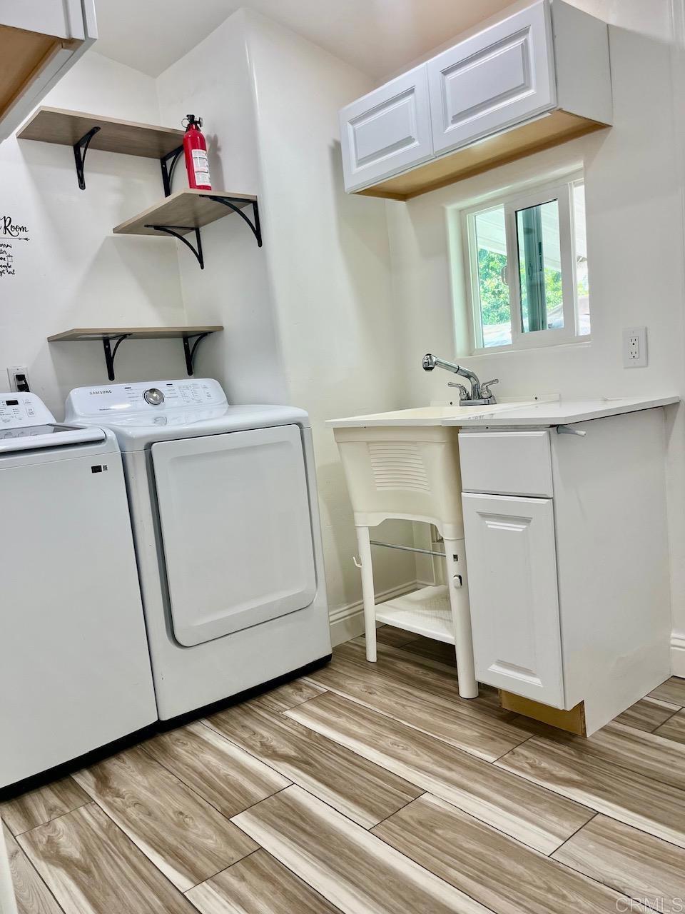 9902 Jamacha Boulevard, Unit 160 Spring Valley, CA 91977 - Photo 14 of 18 a utility room with dryer and washer