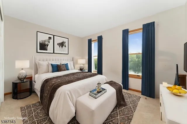 a bedroom with bed and a night stand