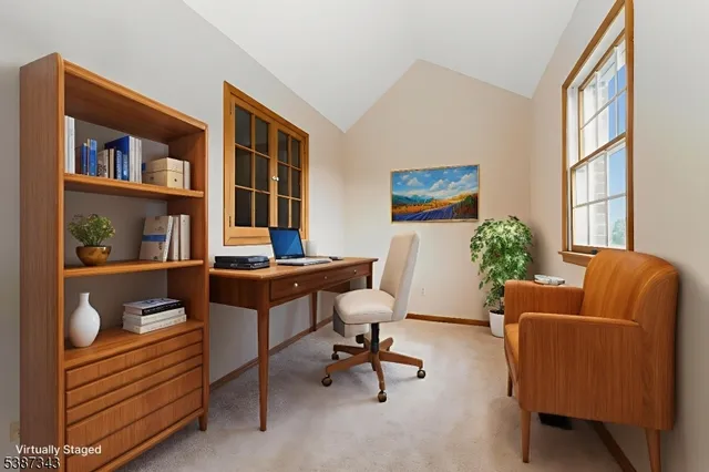 a workspace with furniture and a window