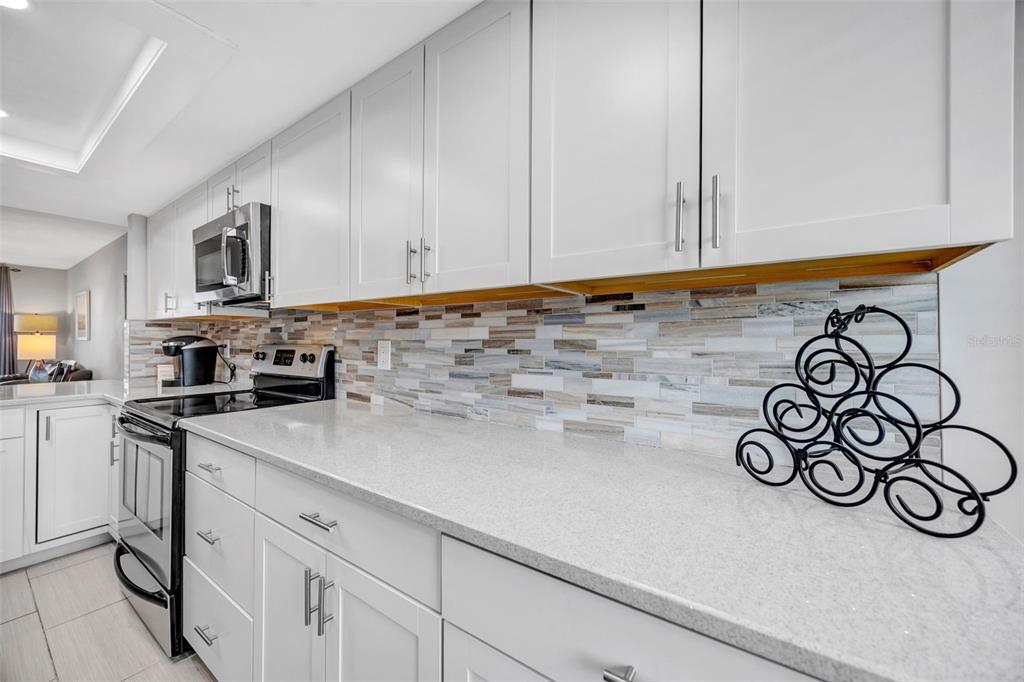 4620 Bay Boulevard, Unit 1117 Port Richey, FL 34668 - Photo 11 of 37 a kitchen with a sink and cabinets