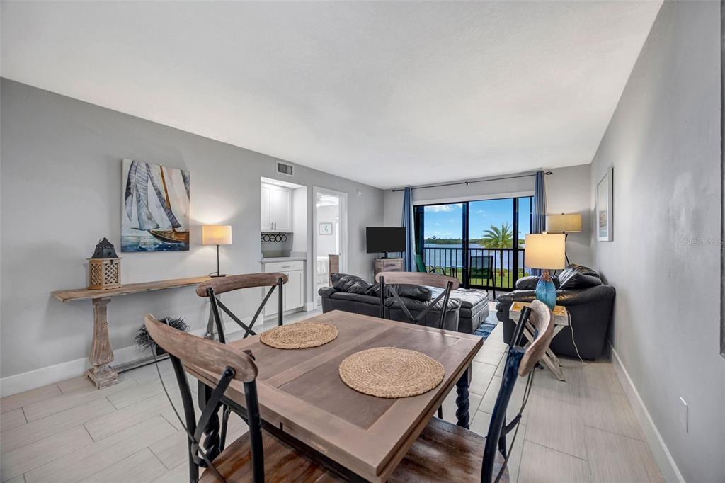 4620 Bay Boulevard, Unit 1117 Port Richey, FL 34668 - Photo 14 of 37 a view of a dining room with furniture