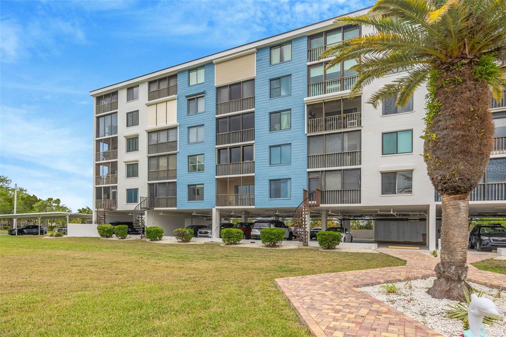 4620 Bay Boulevard, Unit 1117 Port Richey, FL 34668 - Photo 2 of 37 a front view of a building with street