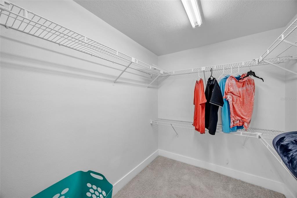 4620 Bay Boulevard, Unit 1117 Port Richey, FL 34668 - Photo 25 of 37 a view of walk in closet with clothes