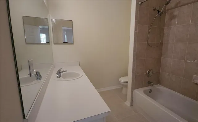 a bathroom with a shower and a toilet