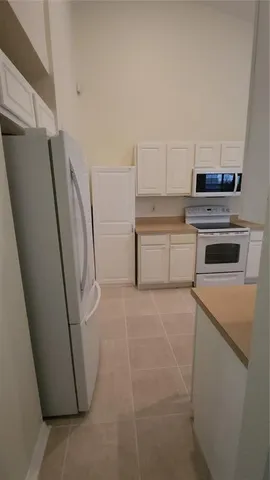 a view of a livingroom with window bathroom