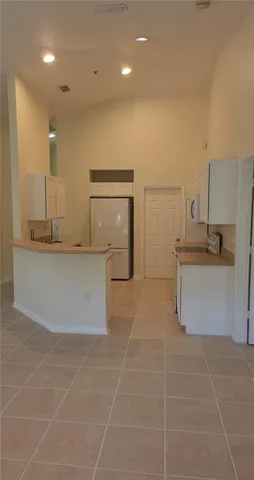 a large kitchen with cabinets