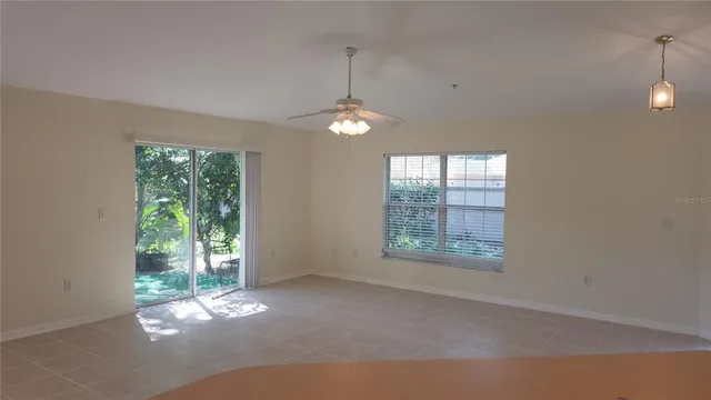 a view of an empty room with windows