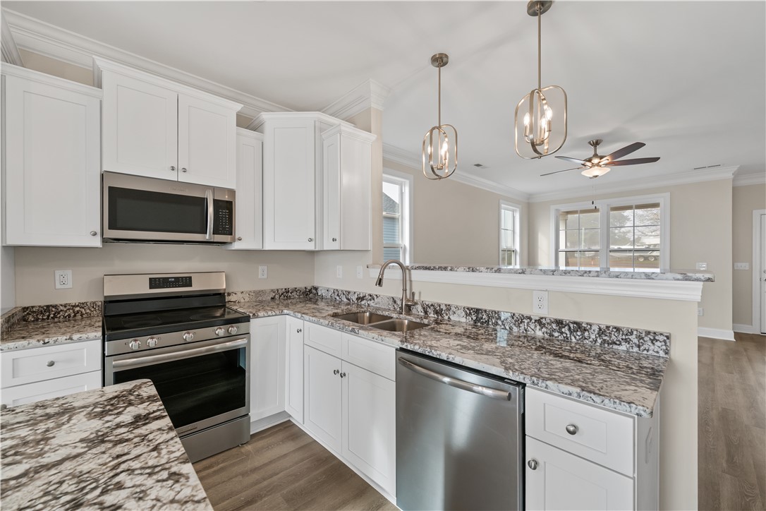 112 Oak Grove Road Norris, SC 29667 - Photo 8 of 19 This modern kitchen features stainless steel appliances and ample counter space, perfect for everyday living.