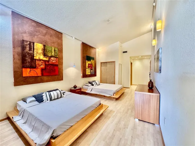 a kitchen with stainless steel appliances granite countertop a refrigerator a stove a sink dishwasher with a dining table and chair