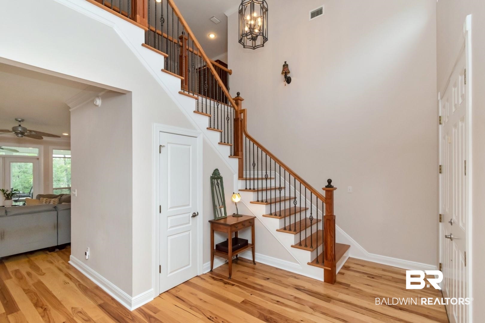 3500 North Riviere Du Chien Loop Mobile, AL 36693 - Photo 7 of 74 Entrance foyer with light wood-type flooring, ornamental molding, and ceiling fan with notable chandelier