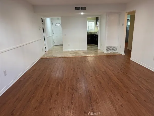 a kitchen with granite countertop wooden cabinets and a sink
