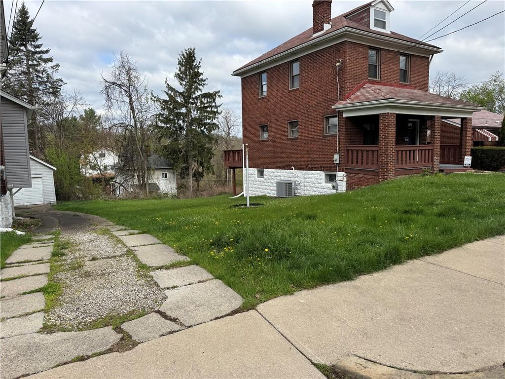 1326 Rutherford Avenue Pittsburgh, PA 15216 - Photo 3 of 3 a front view of a house with a garden