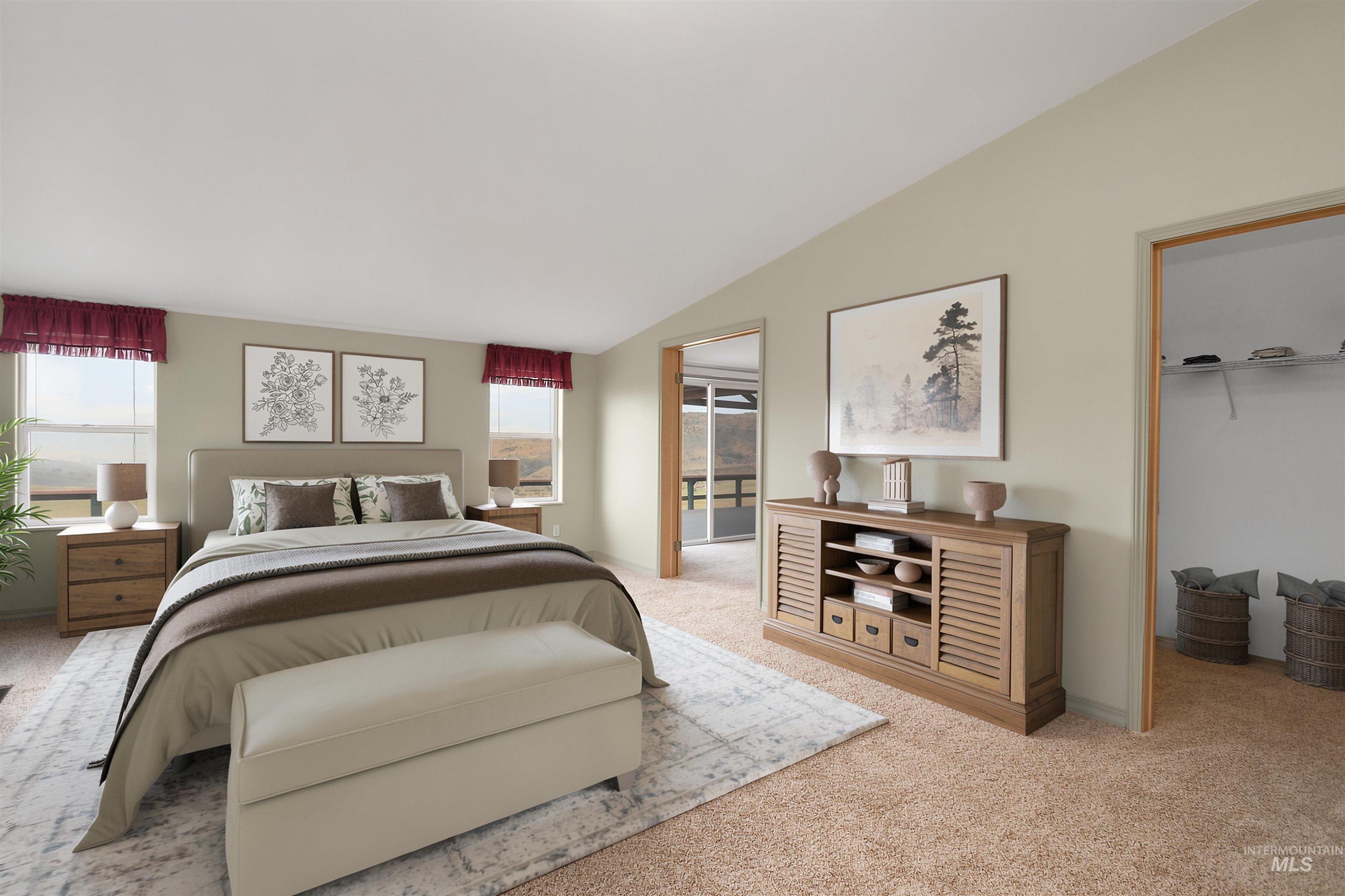 11375 Timber Butte Road Sweet, ID 83670 - Photo 23 of 49 Carpeted bedroom featuring an upholstered headboard, multiple windows with valances, and a vaulted ceiling