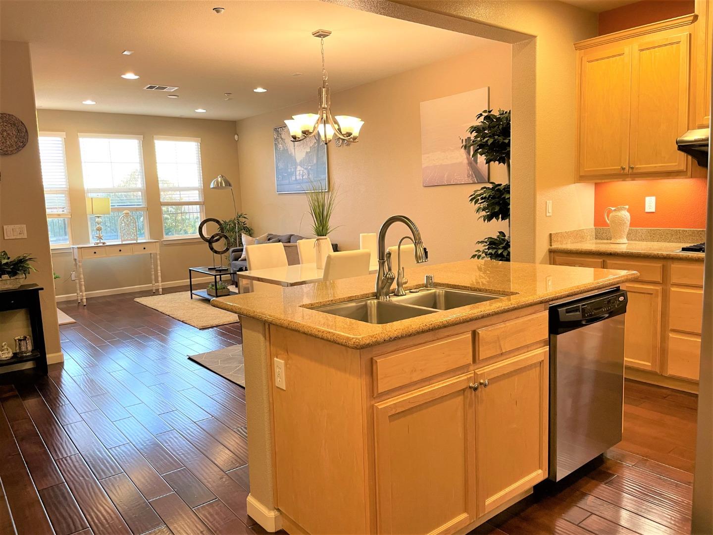 5150 Fioli Loop San Ramon, CA 94582 - Photo 11 of 38 a kitchen with a sink appliances and wooden floor