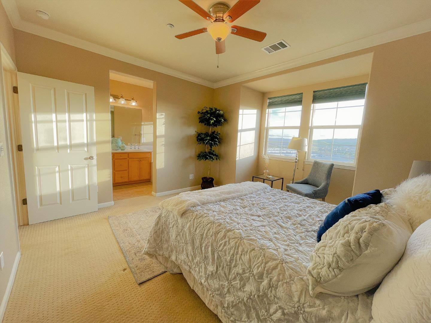 5150 Fioli Loop San Ramon, CA 94582 - Photo 19 of 38 a bedroom with a bed and dresser with mirror