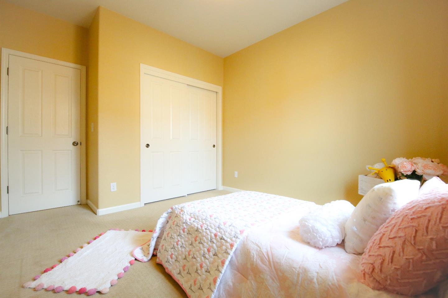 5150 Fioli Loop San Ramon, CA 94582 - Photo 28 of 38 a bedroom with a bed and a painting on the wall