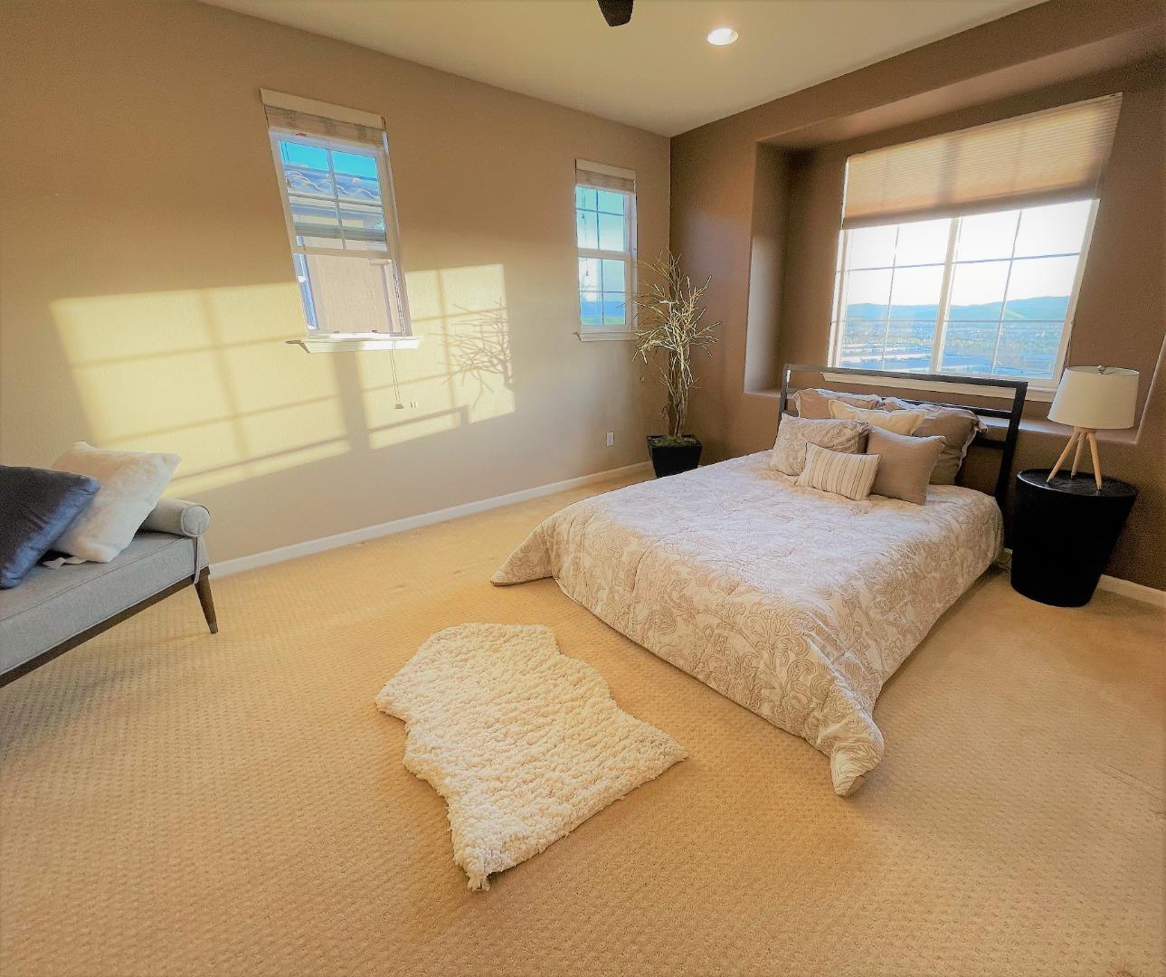 5150 Fioli Loop San Ramon, CA 94582 - Photo 31 of 38 a bedroom with a bed and wooden floor