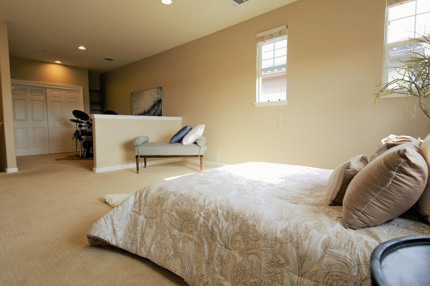 5150 Fioli Loop San Ramon, CA 94582 - Photo 32 of 38 a bedroom with a bed and a chair