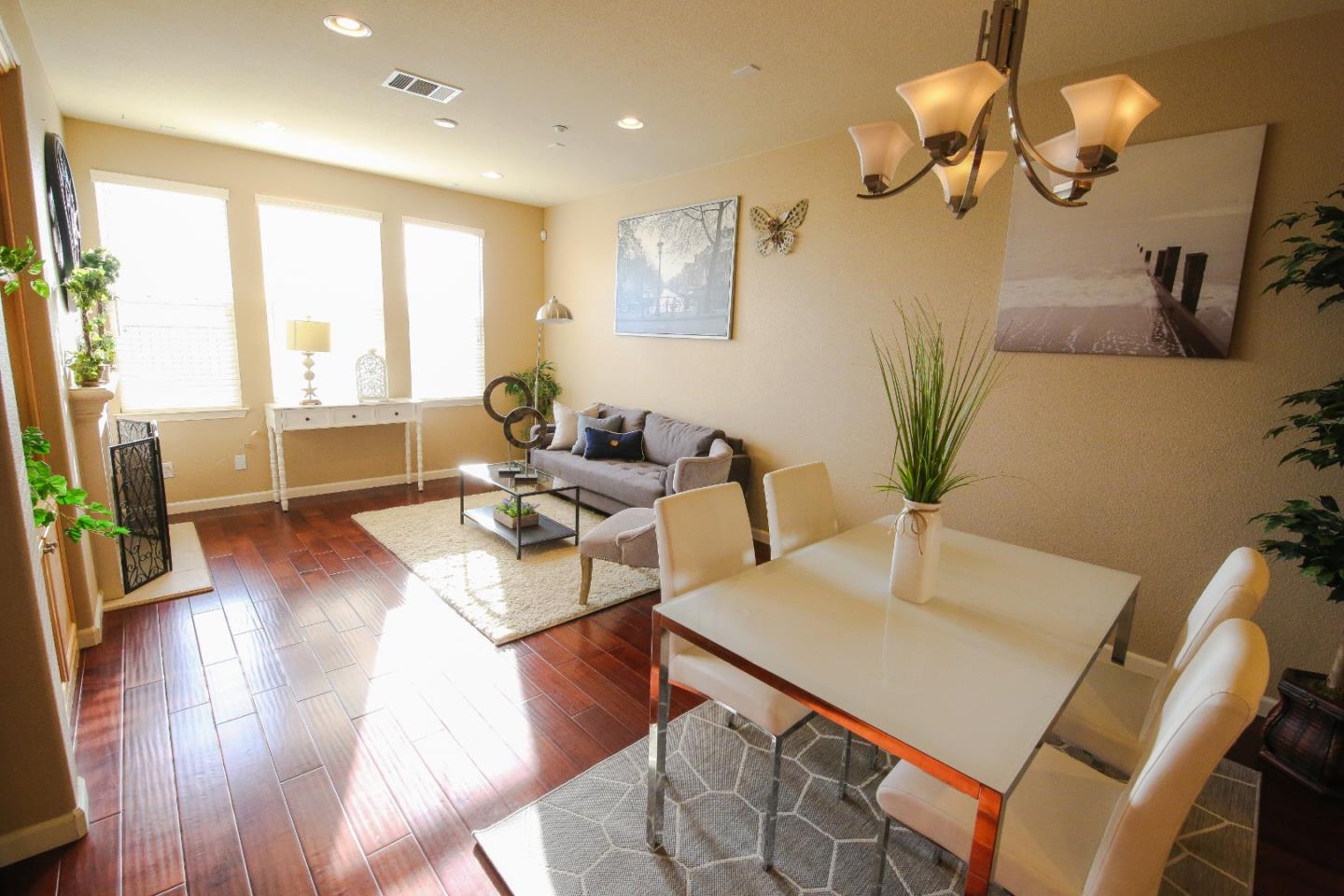 5150 Fioli Loop San Ramon, CA 94582 - Photo 7 of 38 a living room with furniture dining table and a large window