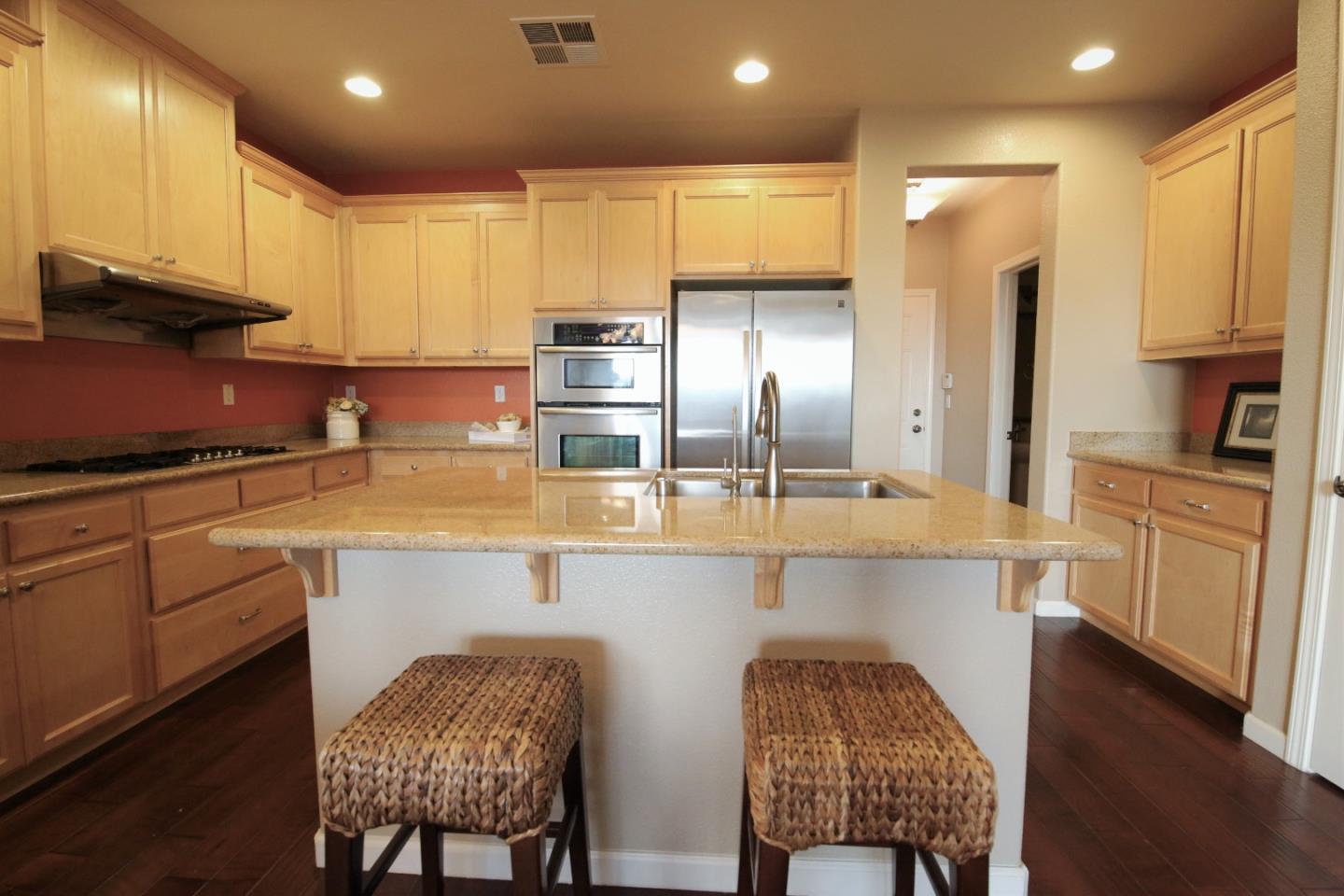 5150 Fioli Loop San Ramon, CA 94582 - Photo 9 of 38 a kitchen with cabinets and chairs