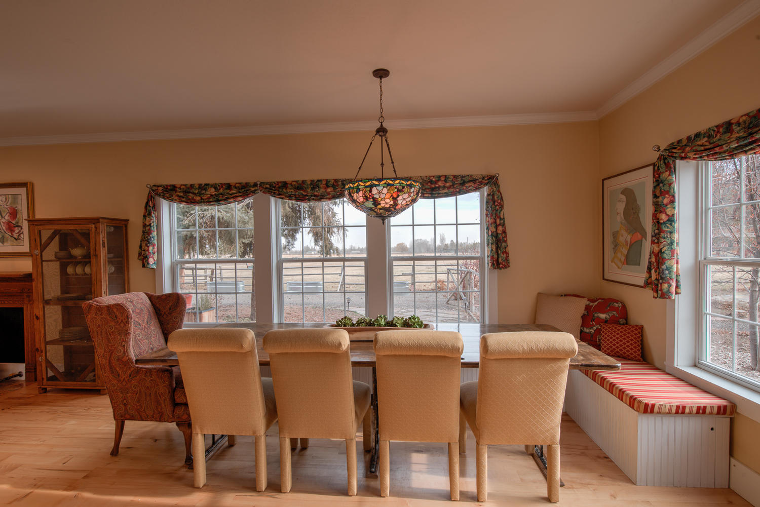 22222 Erickson Road Bend, OR 97701 - Photo 6 of 100 a dining room with furniture a chandelier and window