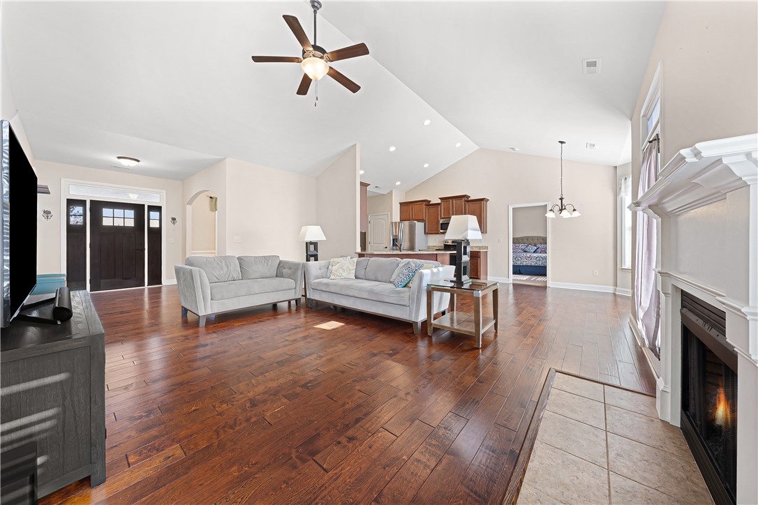 409 Coldstream Court Seneca, SC 29678 - Photo 14 of 40 This bright living space features rich hardwood floors and an inviting fireplace, perfect for gatherings.