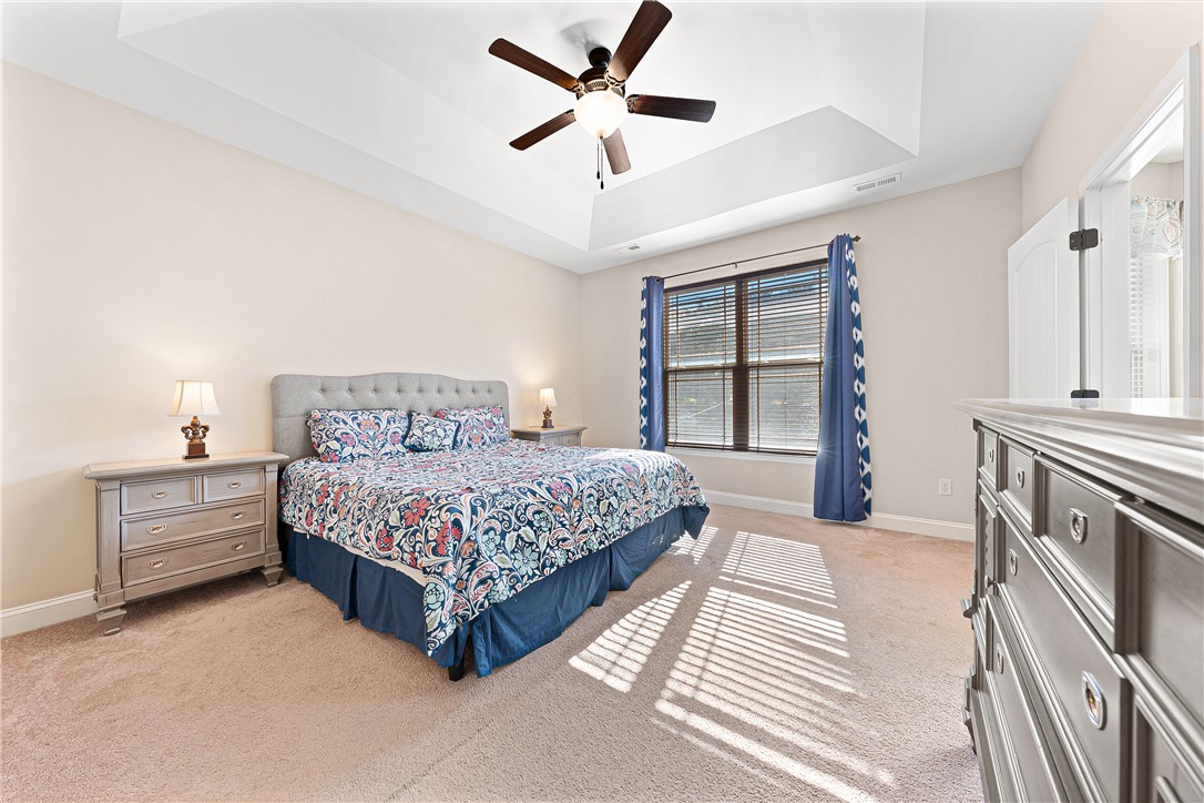409 Coldstream Court Seneca, SC 29678 - Photo 19 of 40 This inviting bedroom offers comfort and natural light.