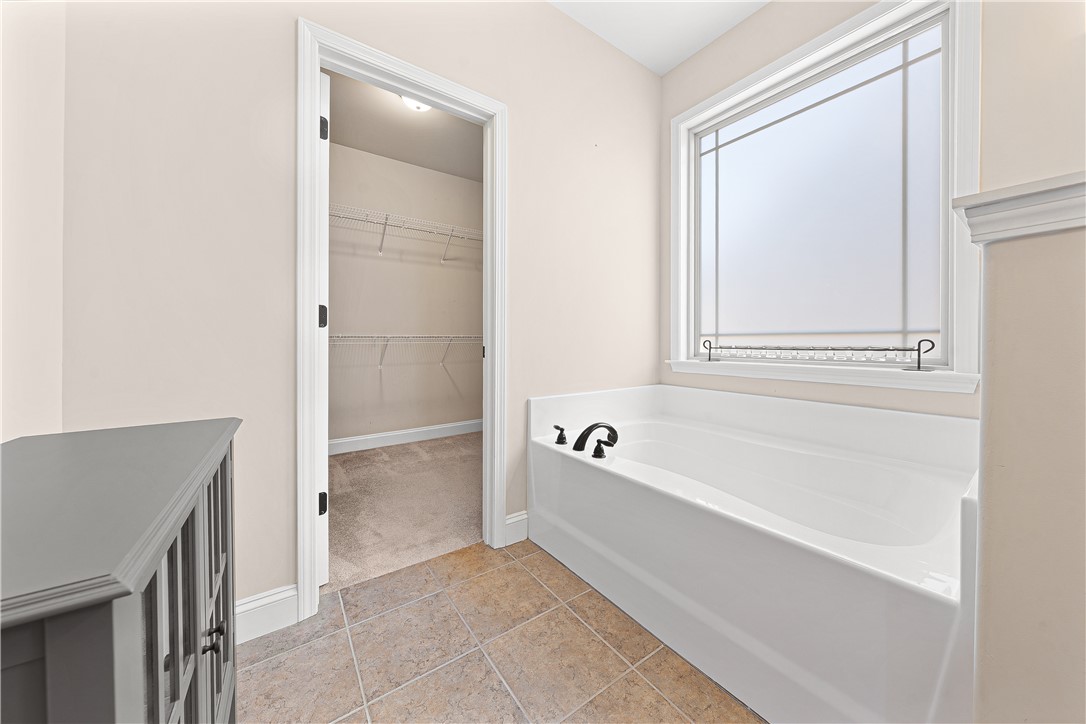 409 Coldstream Court Seneca, SC 29678 - Photo 23 of 40 This tranquil bathroom features a soaking tub and an adjoining walk-in closet for ultimate convenience.