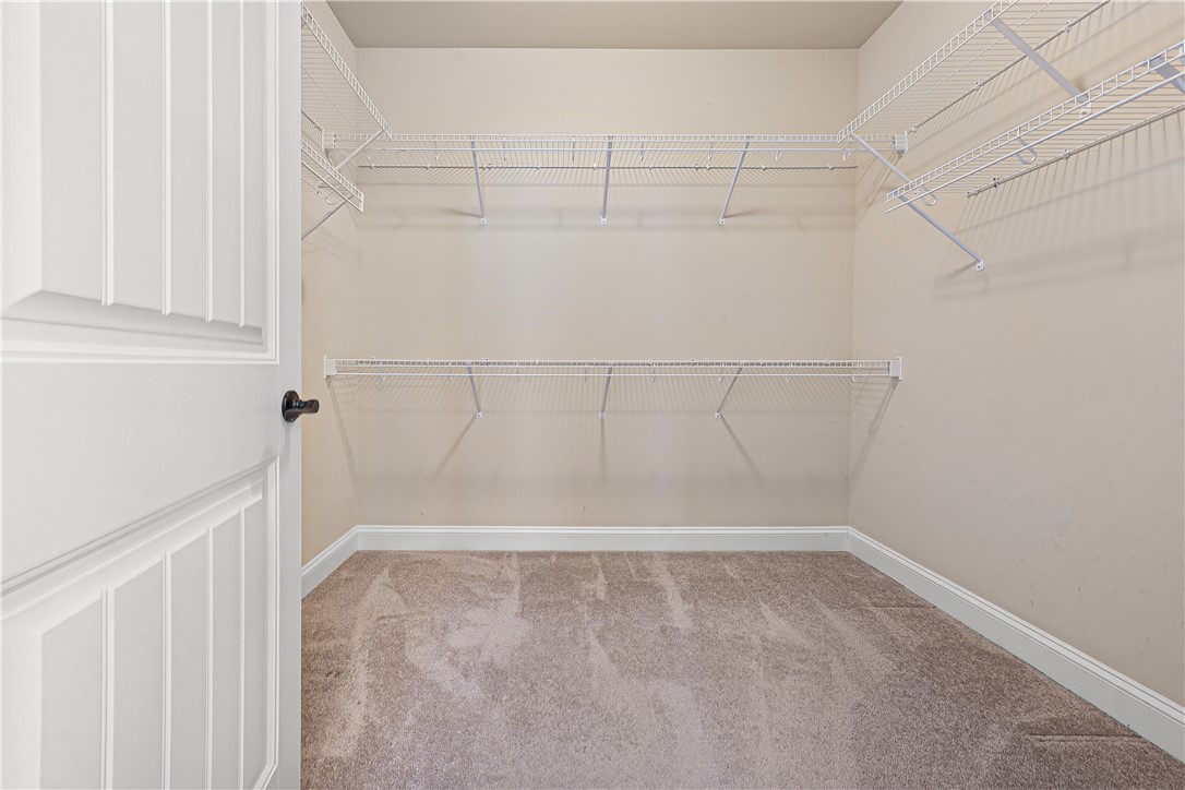 409 Coldstream Court Seneca, SC 29678 - Photo 24 of 40 This spacious walk-in closet offers ample storage with convenient wire shelving and soft carpeting.