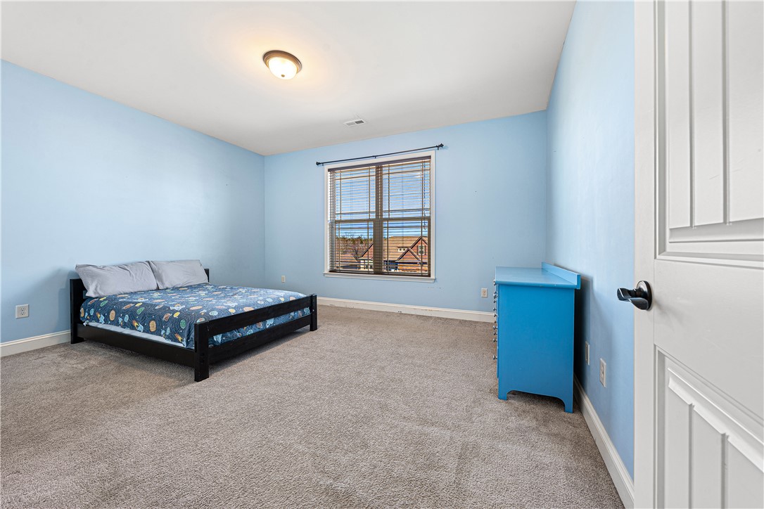 409 Coldstream Court Seneca, SC 29678 - Photo 28 of 40 This cozy bedroom features carpet flooring and a bright window, offering a comfortable personal retreat.