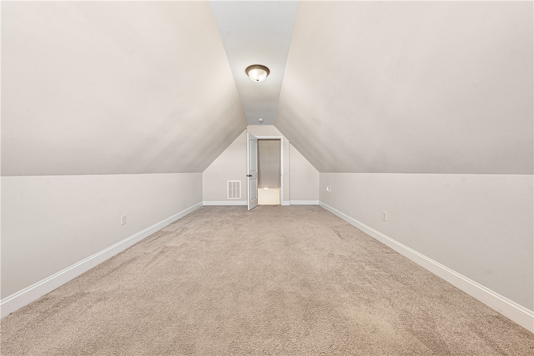 409 Coldstream Court Seneca, SC 29678 - Photo 32 of 40 This spacious attic space features comfortable carpeting, perfect for storage or future customization.