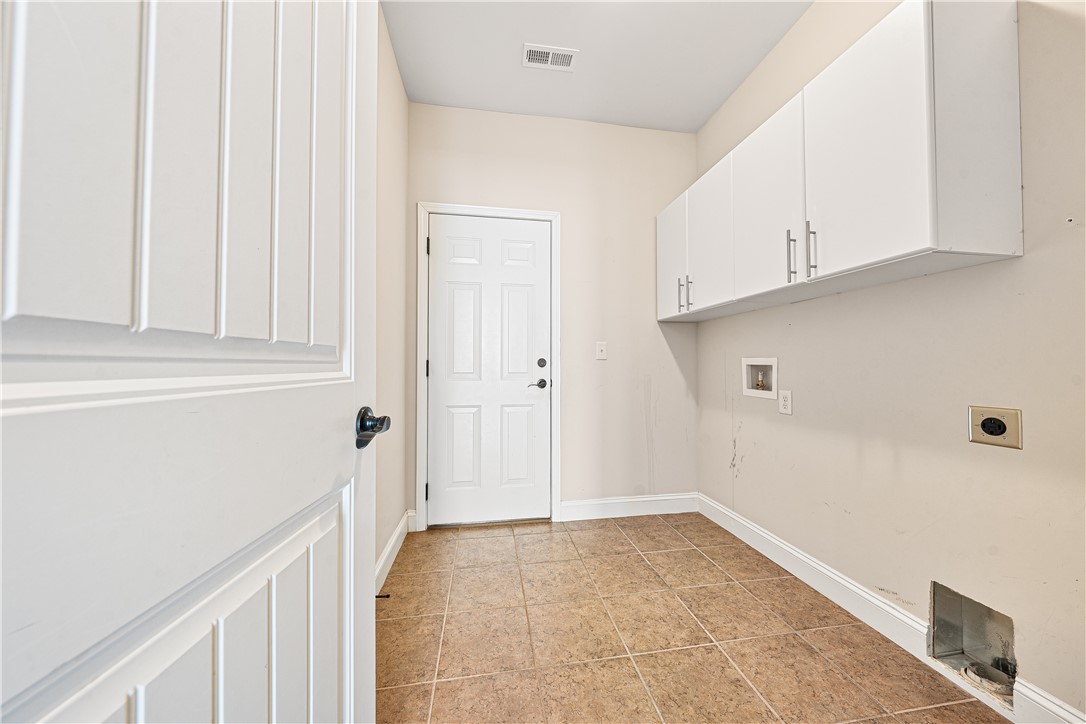409 Coldstream Court Seneca, SC 29678 - Photo 33 of 40 Functional utility room with ample storage and durable tile flooring.