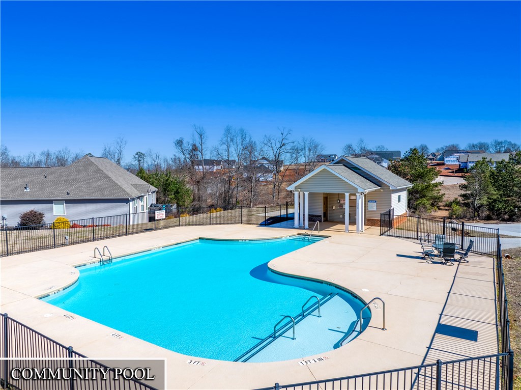 409 Coldstream Court Seneca, SC 29678 - Photo 38 of 40 This inviting outdoor pool area offers a refreshing escape under clear skies.