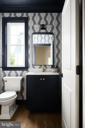 a bathroom with a toilet a sink and a shower