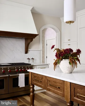 a kitchen with stainless steel appliances a stove and a sink