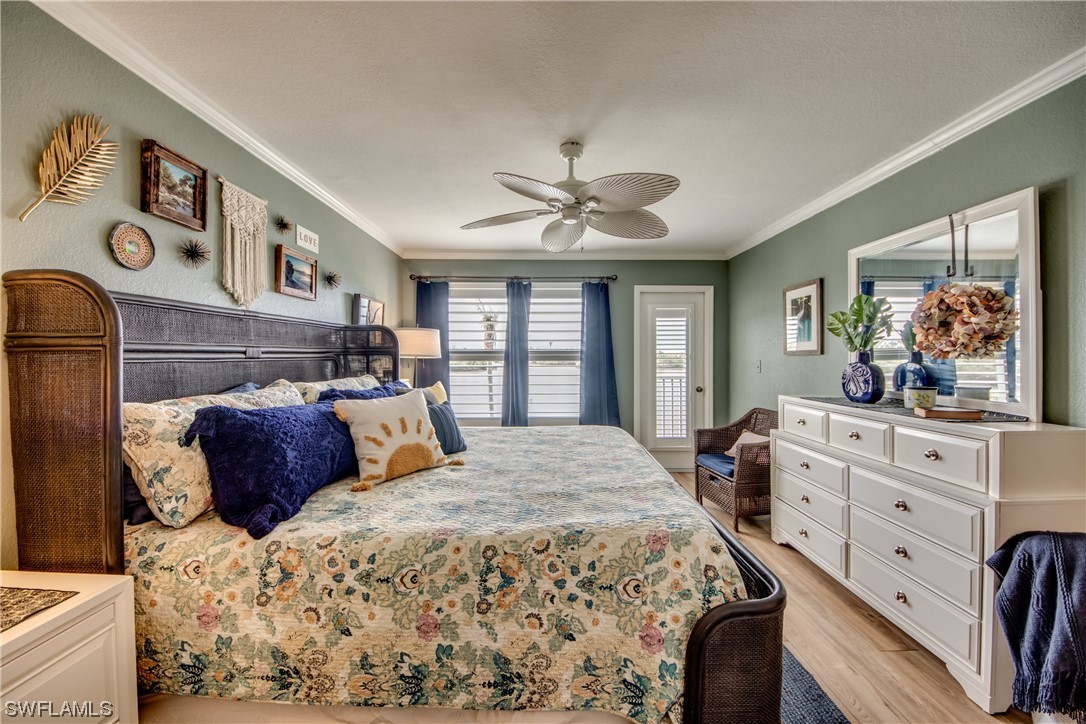 16611 Stringfellow Road, Unit 203 Bokeelia, FL 33922 - Photo 21 of 48 a bedroom with a large bed and a window