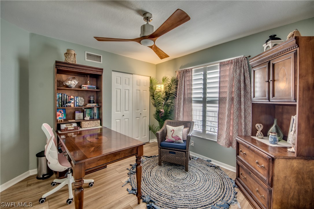 16611 Stringfellow Road, Unit 203 Bokeelia, FL 33922 - Photo 26 of 48 a living room with furniture and a window