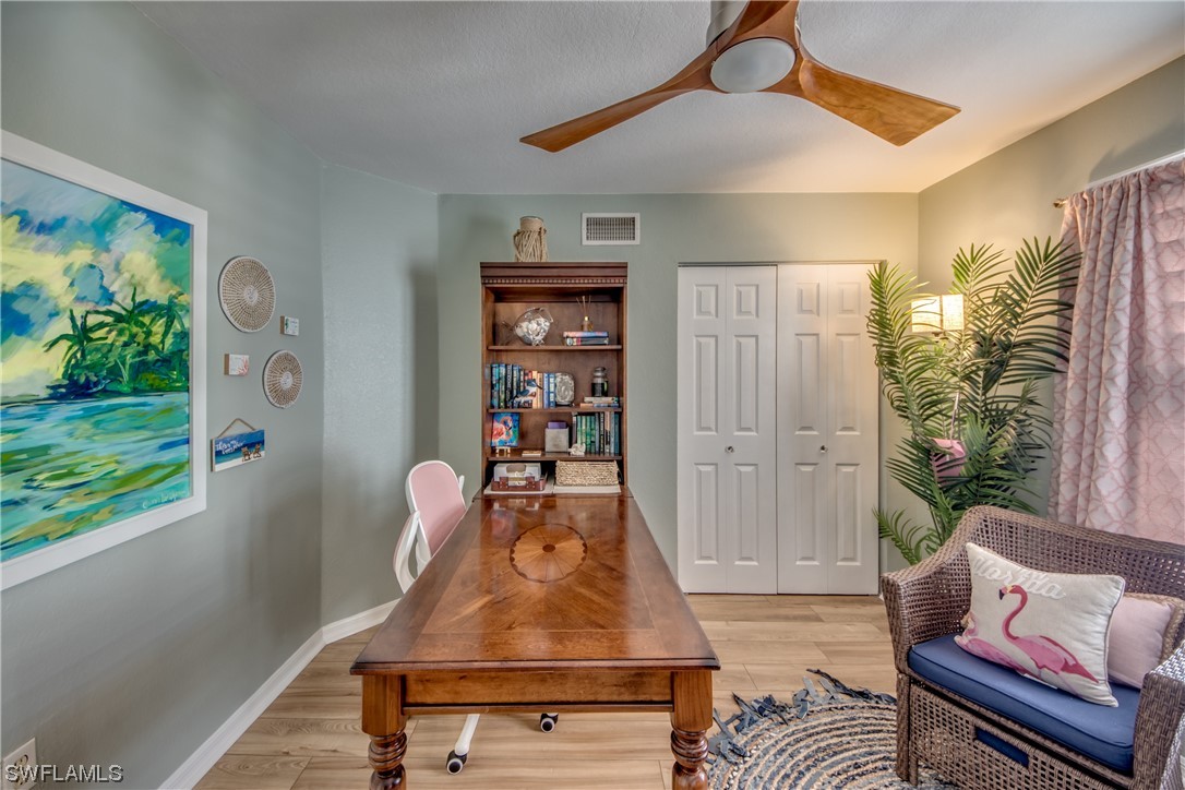 16611 Stringfellow Road, Unit 203 Bokeelia, FL 33922 - Photo 27 of 48 a living room with furniture and a window
