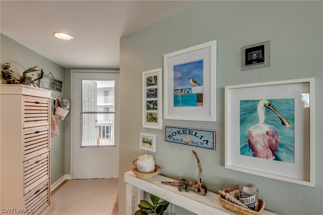 16611 Stringfellow Road, Unit 203 Bokeelia, FL 33922 - Photo 30 of 48 a room with furniture and window