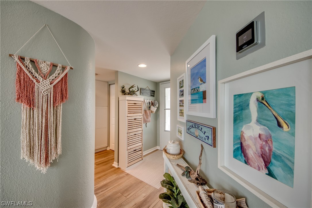 16611 Stringfellow Road, Unit 203 Bokeelia, FL 33922 - Photo 31 of 48 a view of an entryway with wooden floor