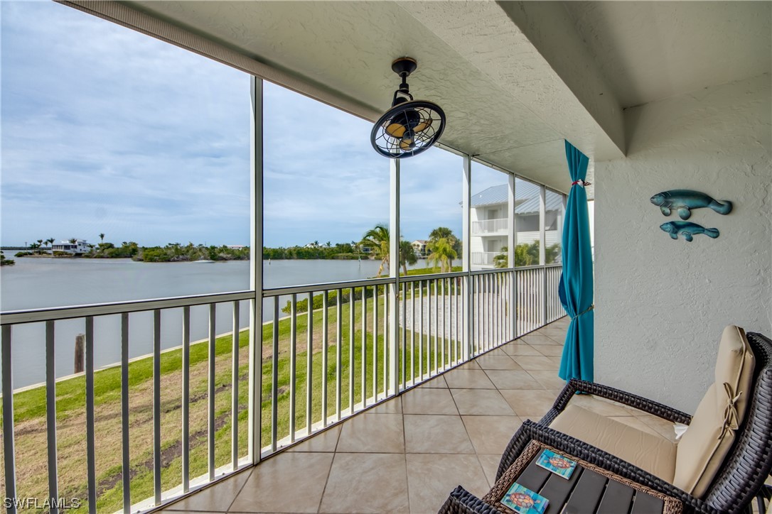 16611 Stringfellow Road, Unit 203 Bokeelia, FL 33922 - Photo 35 of 48 a view of a city from a balcony