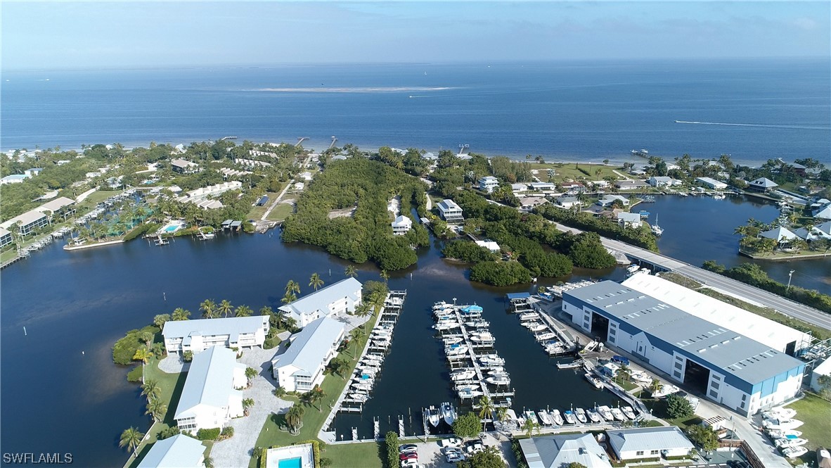 16611 Stringfellow Road, Unit 203 Bokeelia, FL 33922 - Photo 47 of 48 an aerial view of a city with ocean view