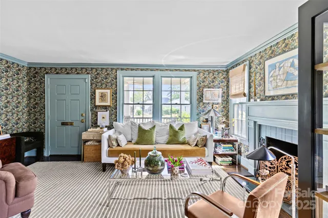 a living room with furniture and a fireplace
