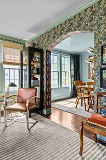 a living room filled with furniture and wooden floor