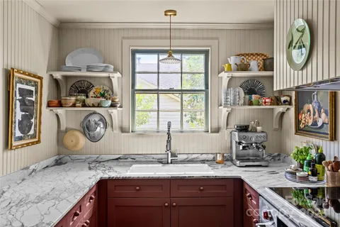 a kitchen with sink and cabinets