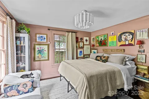 a bathroom with a toilet a sink and a window