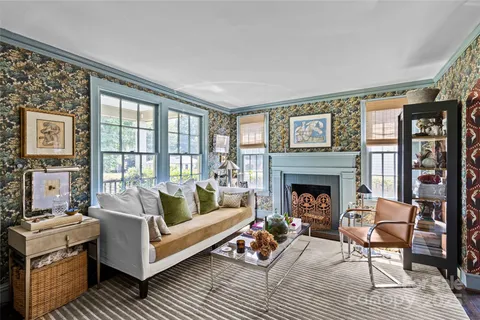 a living room with furniture and a fireplace