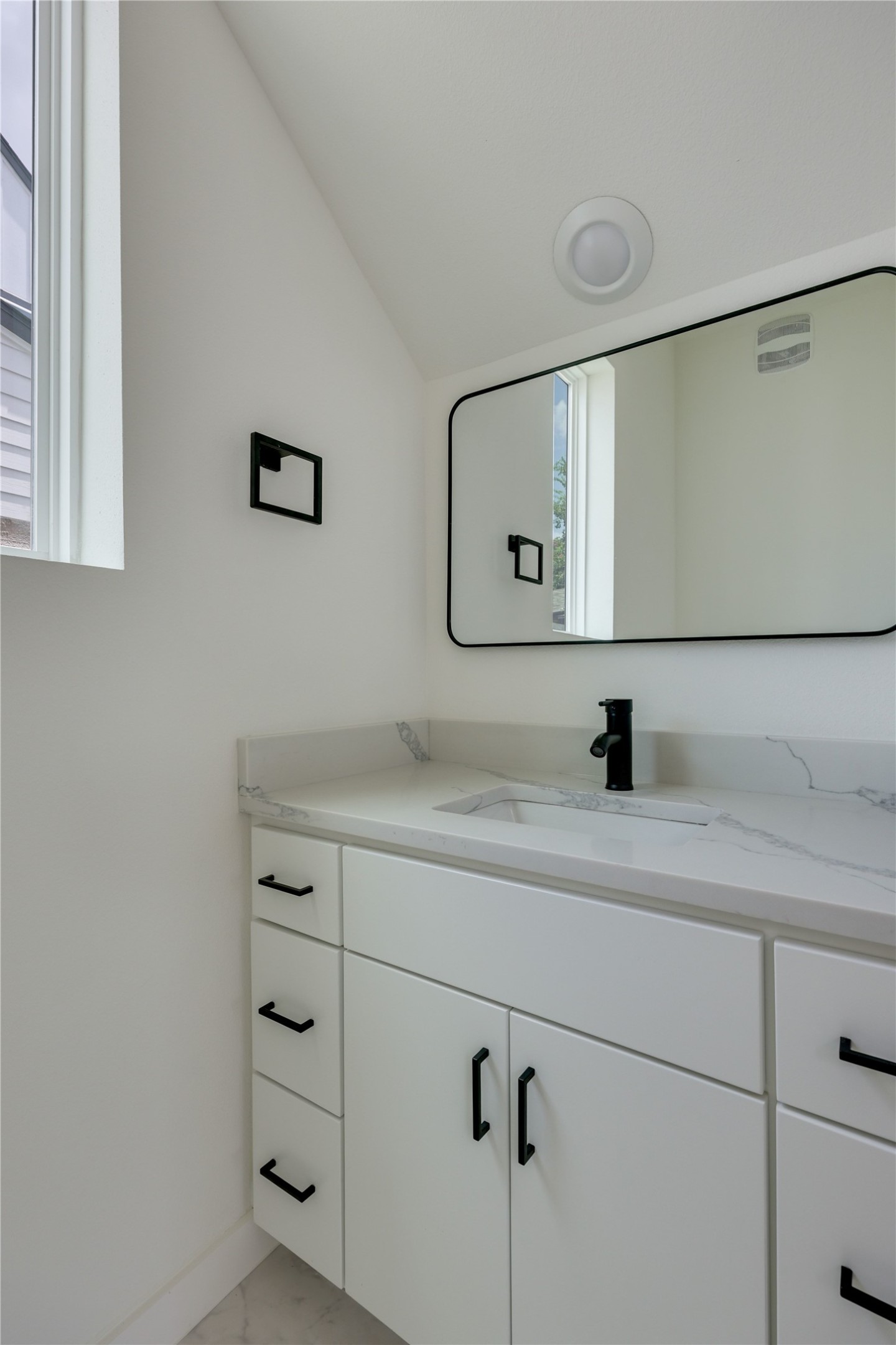 6809 Porter Street, Unit 2 Austin, TX 78741 - Photo 25 of 37 Powder bath located on the main floor.